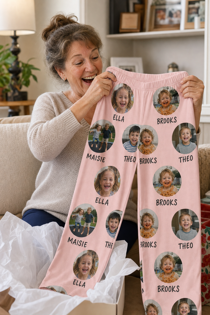 A grandmother holding up custom pajama pants printed with her grandkids' photos and names