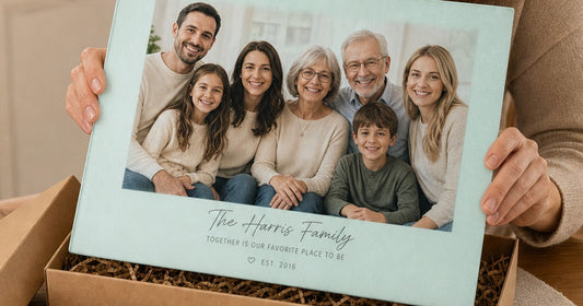 Personalized glass cutting board gift with a family photo and surname presented in a gift box.