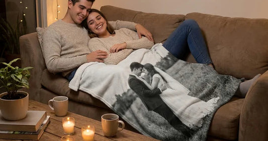 Anniversary blanket with a then-and-now couple photo layout in a warm home setting.