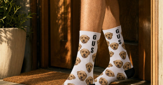 Custom photo socks shown as a pair with black heels and toes for a size and selection guide.