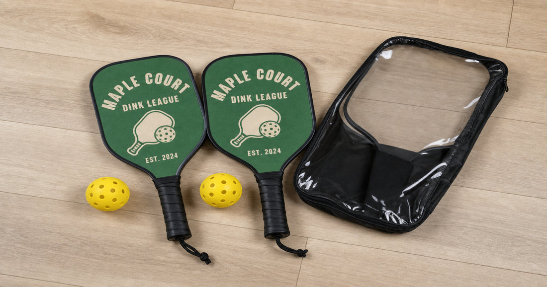 Complete custom pickleball set with two matching personalized paddles, two balls, and a carry bag.