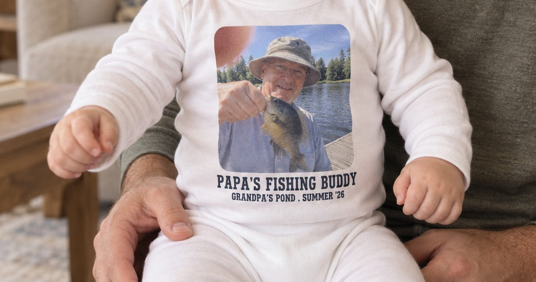 Baby wearing a white long-legged bodysuit personalized with a fishing photo and Papa's Fishing Buddy text.