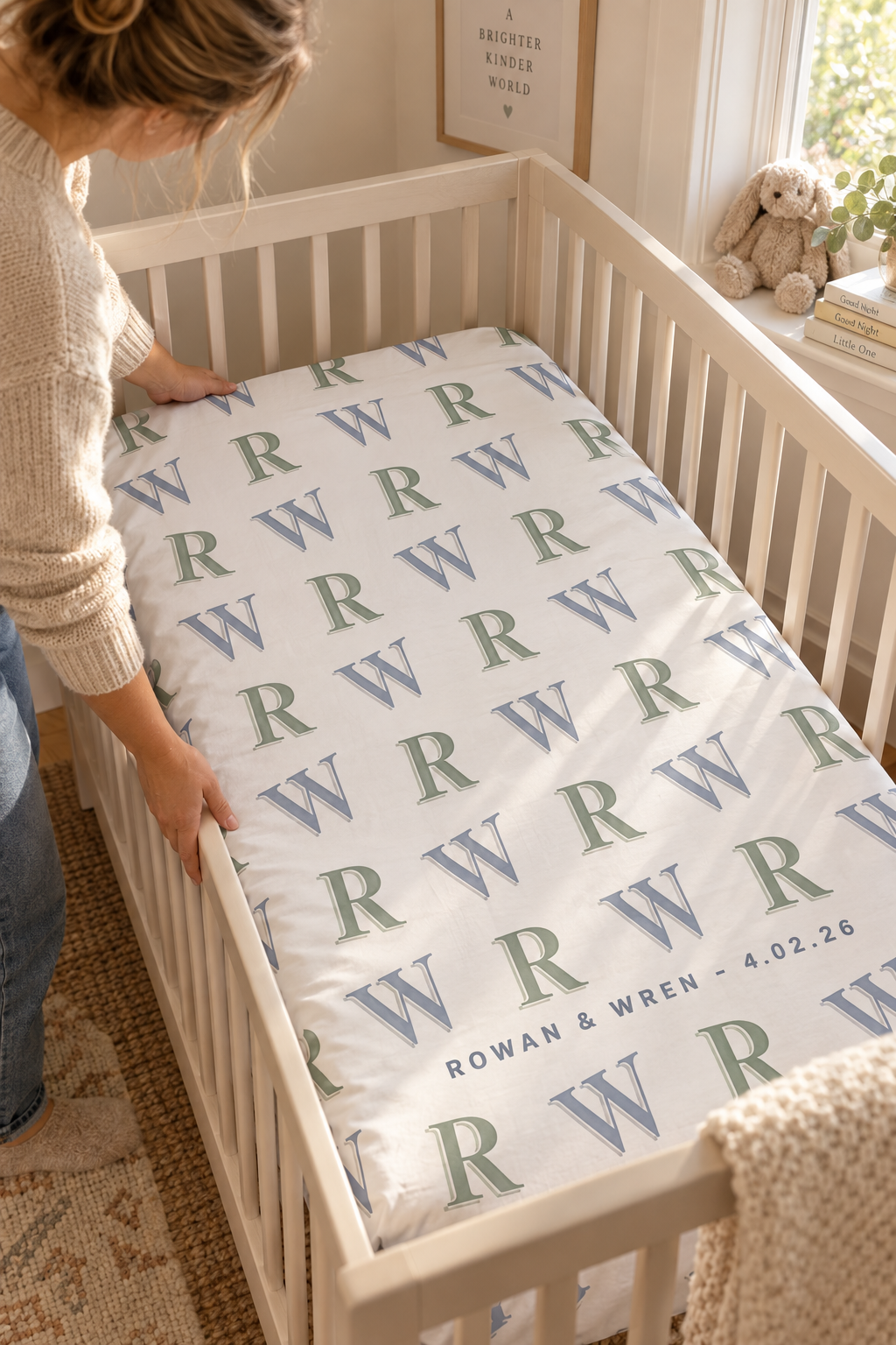A custom fitted crib sheet printed in nursery colors pulled from the rest of the room