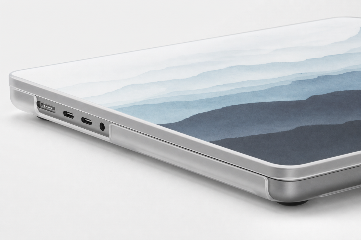 Side view of the custom MacBook case showing the shell cutouts leaving the laptop's side ports open