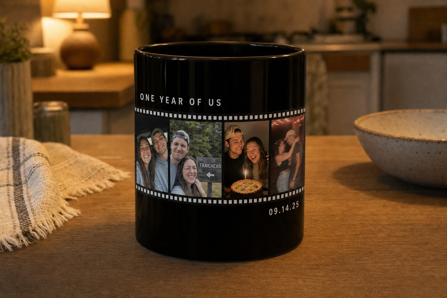 Black mug printed with a couple photo filmstrip and the text ONE YEAR OF US