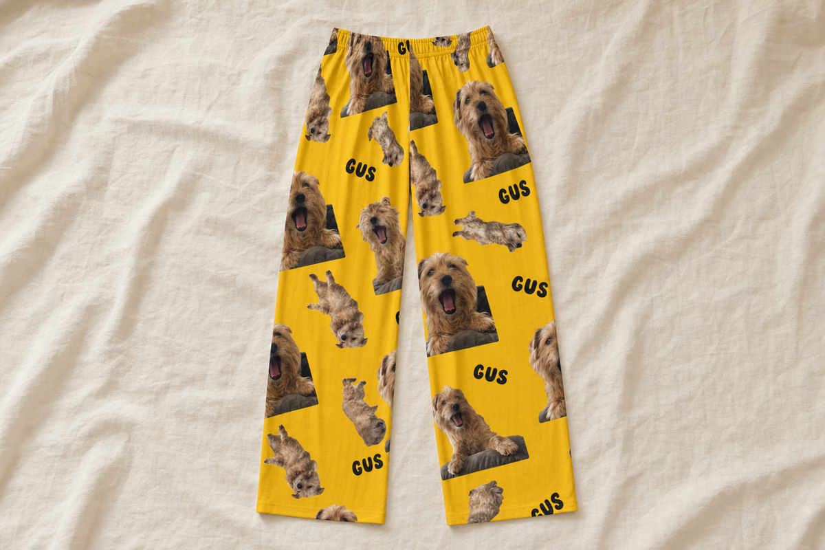 Custom pajama pants flat on linen with a terrier photo design printed edge to edge on both legs
