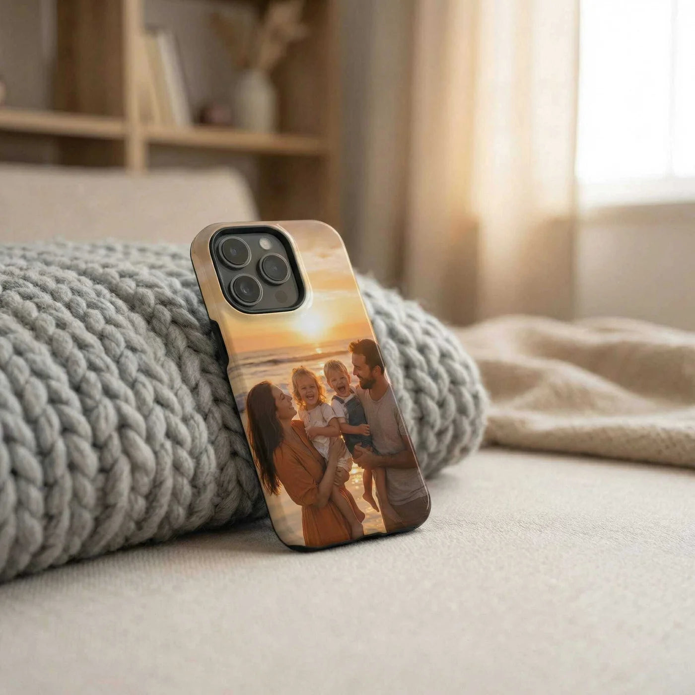 Custom phone case with family beach sunset photo leaning on knit blanket � personalized by Custom Envy