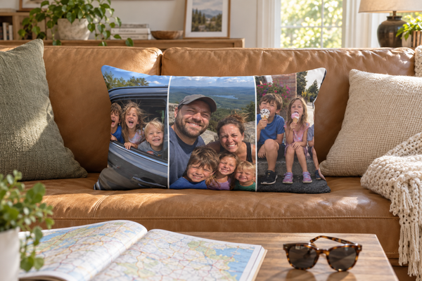 Lumbar pillow printed with three family road-trip photos on a leather sofa