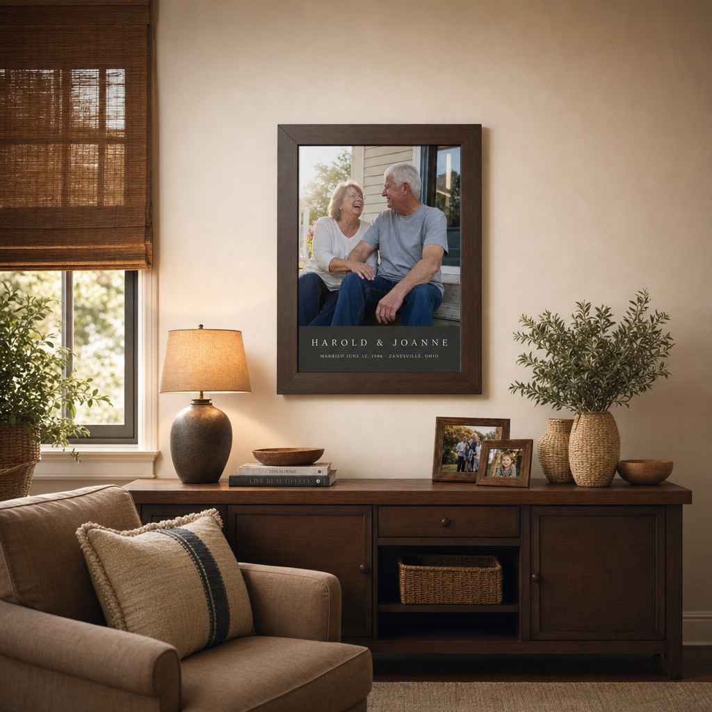 A walnut-framed photo poster of grandparents with their grandkids hanging on a living room wall