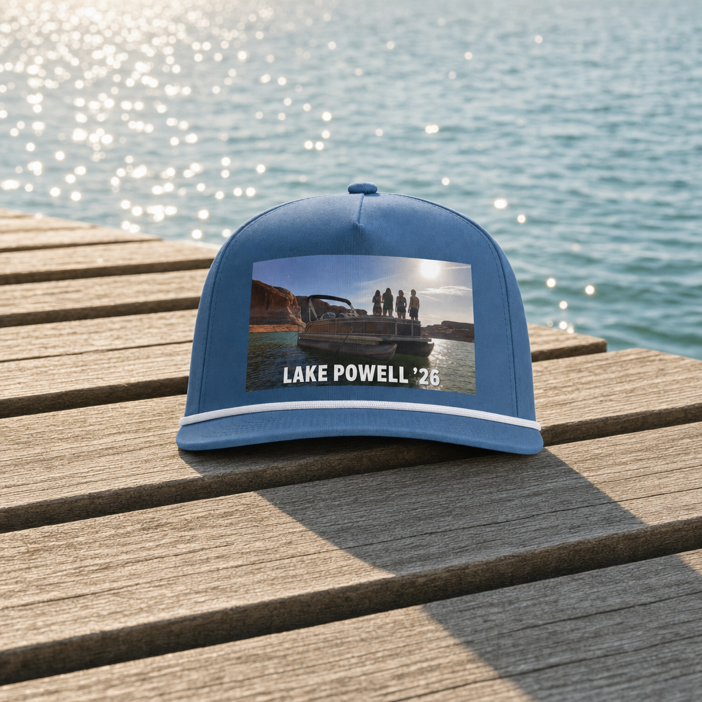 Custom rope cap with a lake trip photo and trip text printed on the front, resting on a dock, full cap with margin