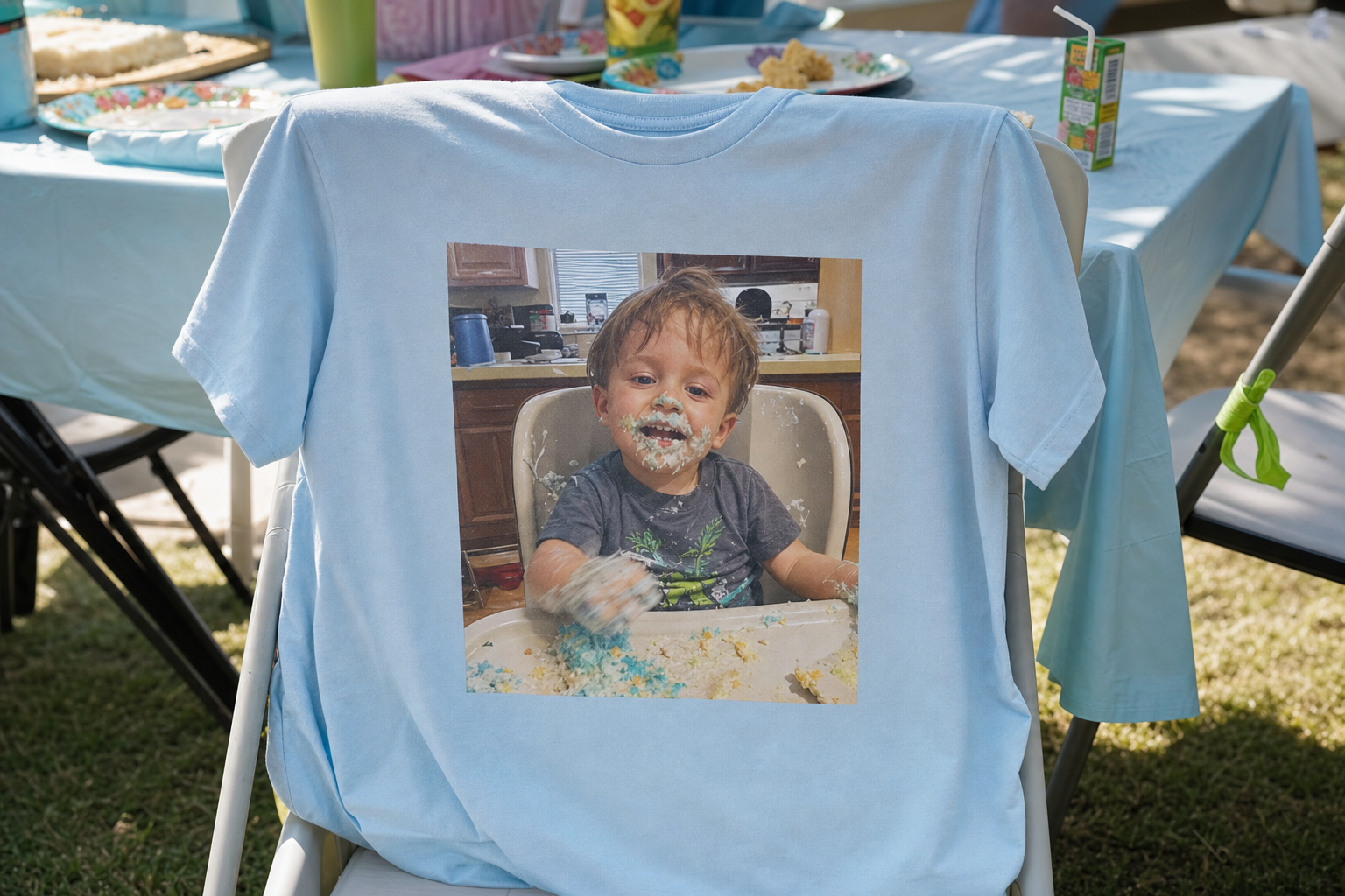 Light blue custom t-shirt printed with a candid cake-smash photo of a toddler