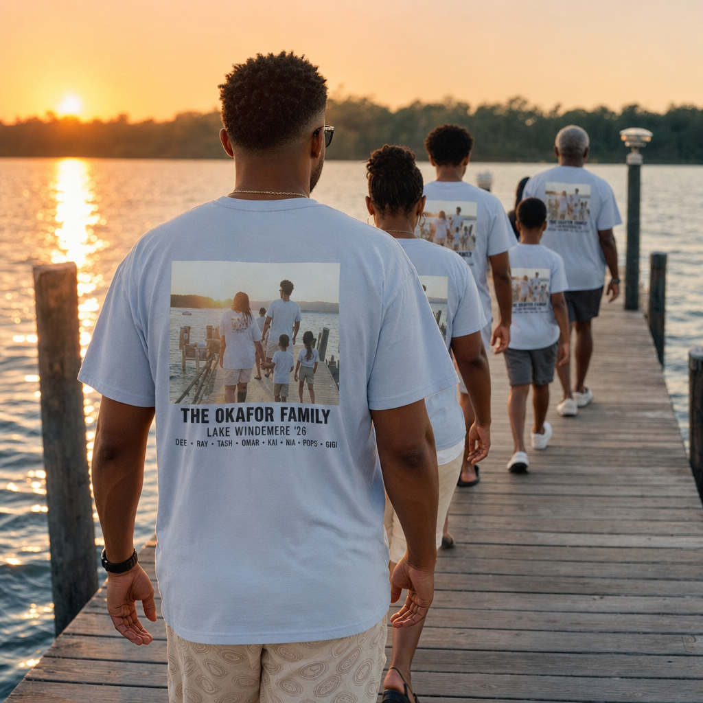 A family walking down a lake dock in matching light blue custom t-shirts with big back prints