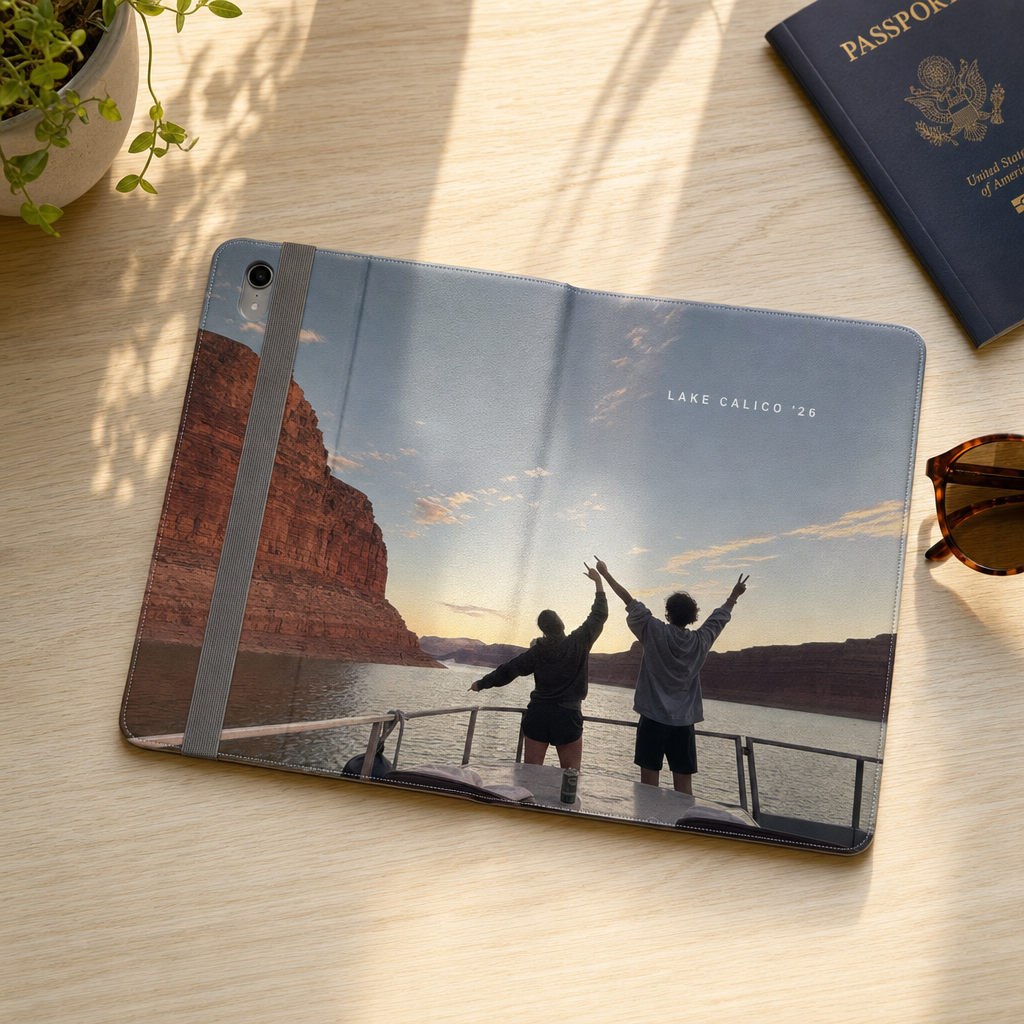 Custom iPad folio case lying open to show a lake panorama photo printed across the whole cover with the text Lake Calico 26