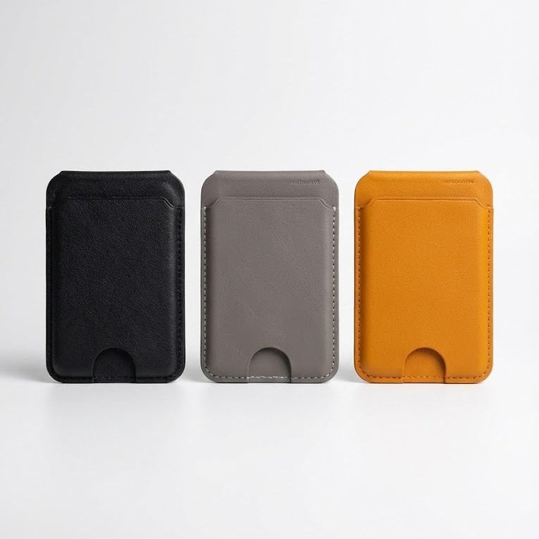 Three card holders in black, gray, and orange on a white background
