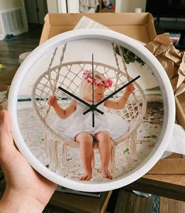 Customer holding custom photo clock just unboxed