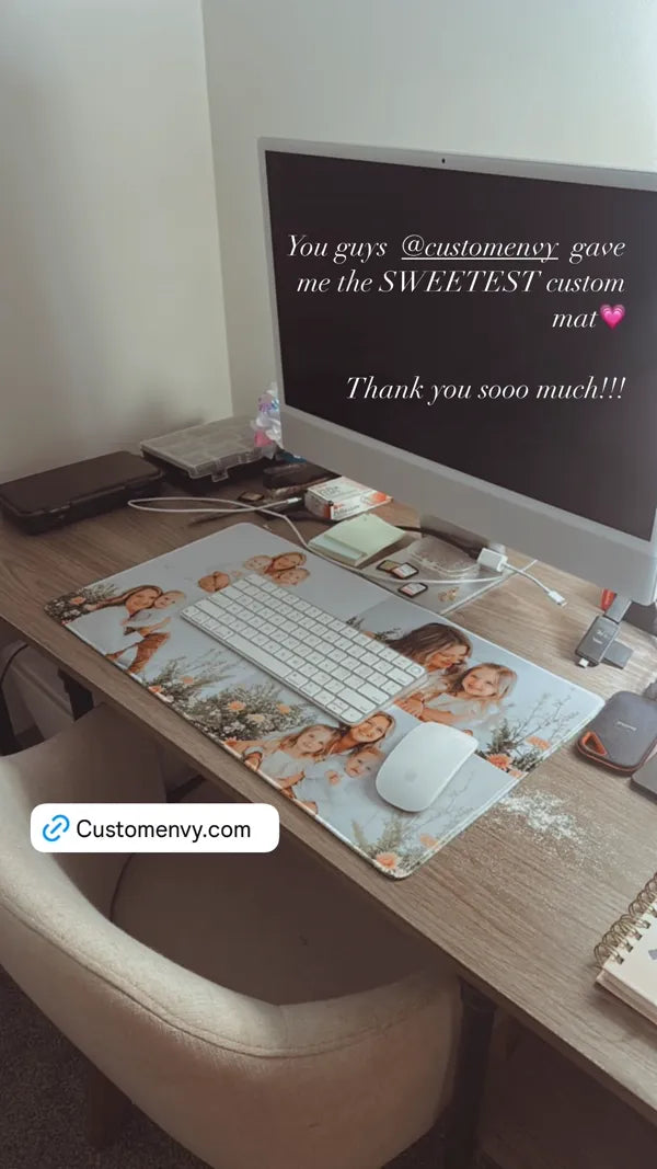Custom family photo desk mat under iMac with keyboard and mouse on wooden desk
