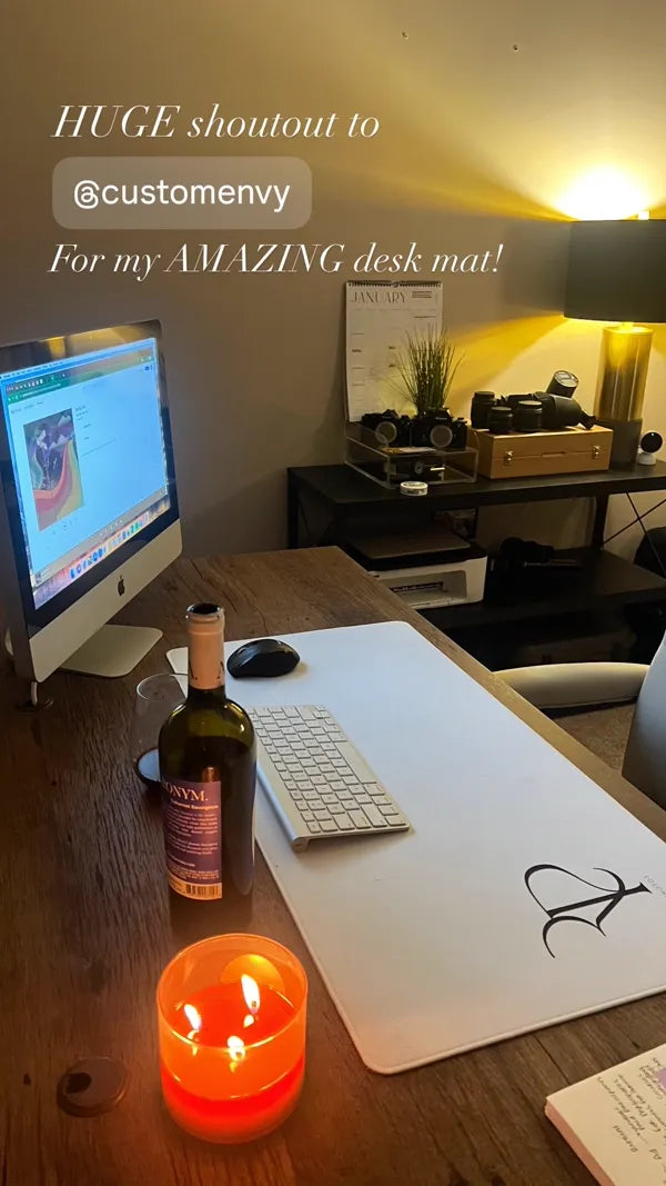 Custom monogram initial desk mat with iMac and candle in cozy home office