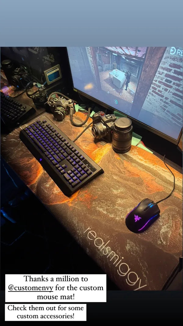 Gaming setup with custom lava terrain art desk mat and RGB peripherals