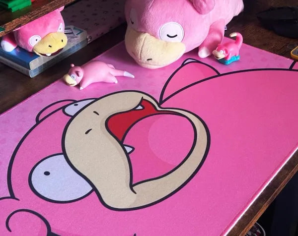 Pink cartoon character desk mat with matching plush toys
