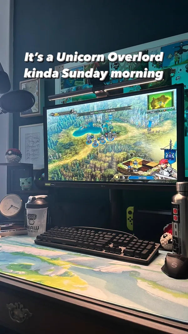 Gaming setup with custom watercolor art desk mat in dark room